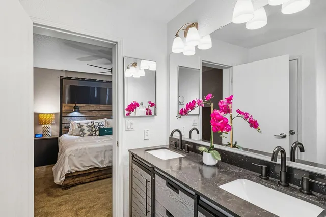 a bathroom with a shower and a walk in closet
