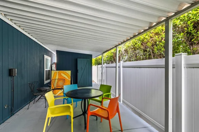 a backyard of a house with a tree