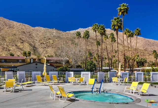 a view of a swimming pool with a patio