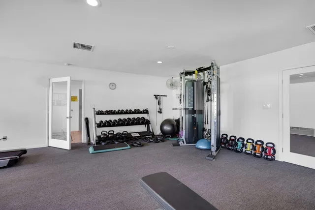 a view of a swimming pool with sitting area
