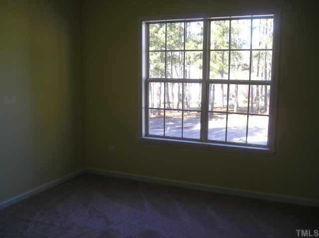 5543 Fieldcross Court Raleigh, NC 27610 - Photo 7 of 9 Nice size master has WIC with built in shelves