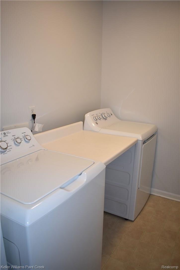 1885 Flagstone Circle Rochester, MI 48307 - Photo 31 of 32 THE LARGE LAUNDRY ROOM (6 X 11) IS FURNISHED WITH A GE WASHER, GE DRYER & A FOLDING COUNTER