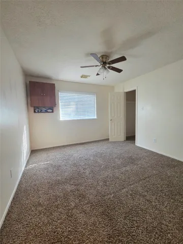 a view of a big room with carpet