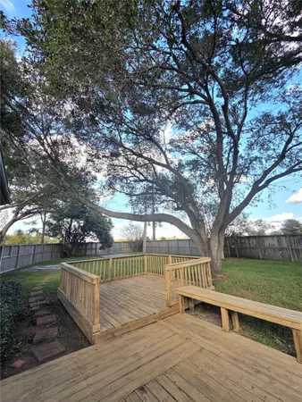 a view of a deck with a yard