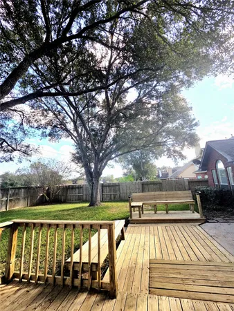 a view of backyard with pool and lake view