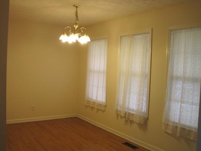 6089 Hunters Point Pike Lebanon, TN 37087 - Photo 4 of 17 Separate Dining room, with 3 windows and hardwood flooring. Would make great office too!