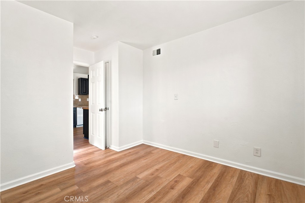 1720 Anderson Street Simi Valley, CA 93065 - Photo 9 of 30 a view of a room with wooden floor and a hallway