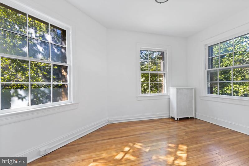 2707 Adams Mill Road Northwest, Unit 205 Washington, DC 20009 - Photo 22 of 28 a view of an empty room with a window