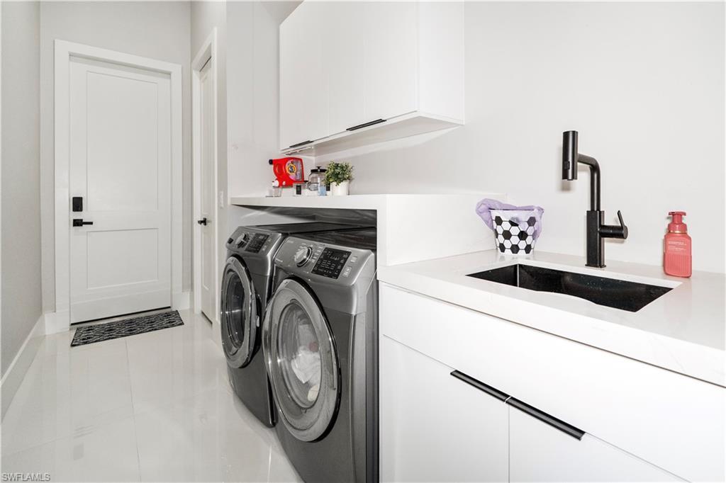 2313 6th Avenue Southeast Naples, FL 34117 - Photo 12 of 36 a utility room with dryer and washer