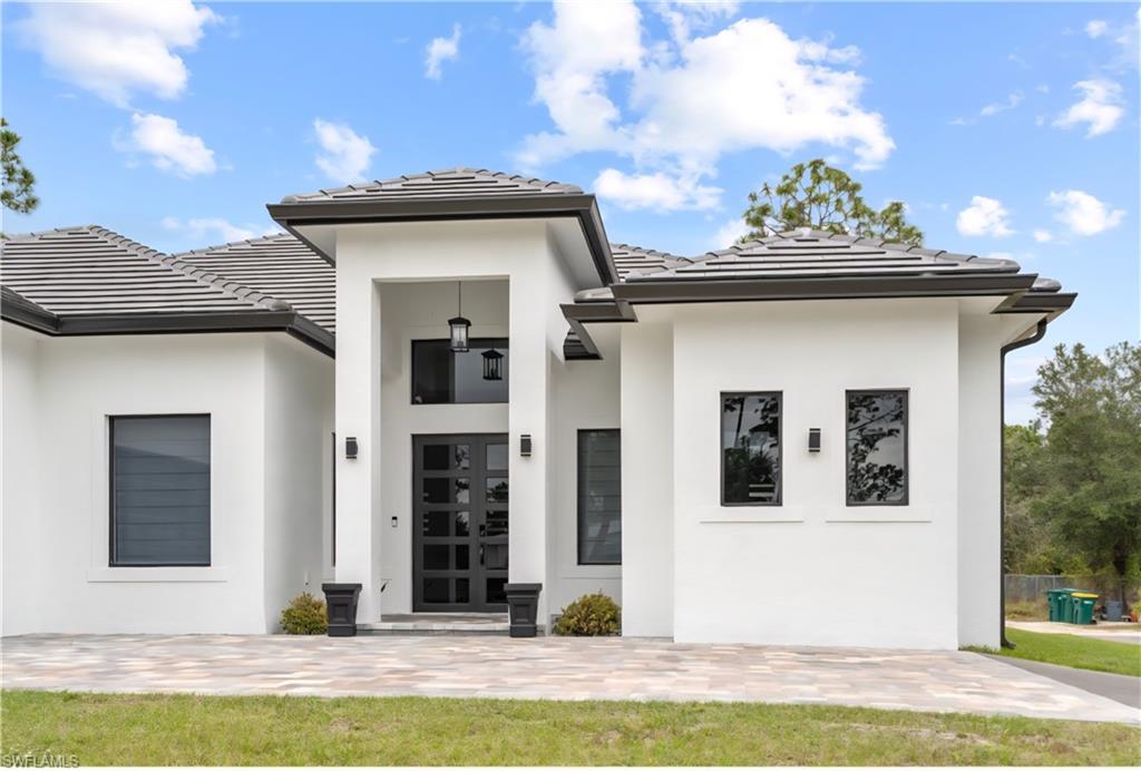 2313 6th Avenue Southeast Naples, FL 34117 - Photo 19 of 36 a view of a house with a swimming pool