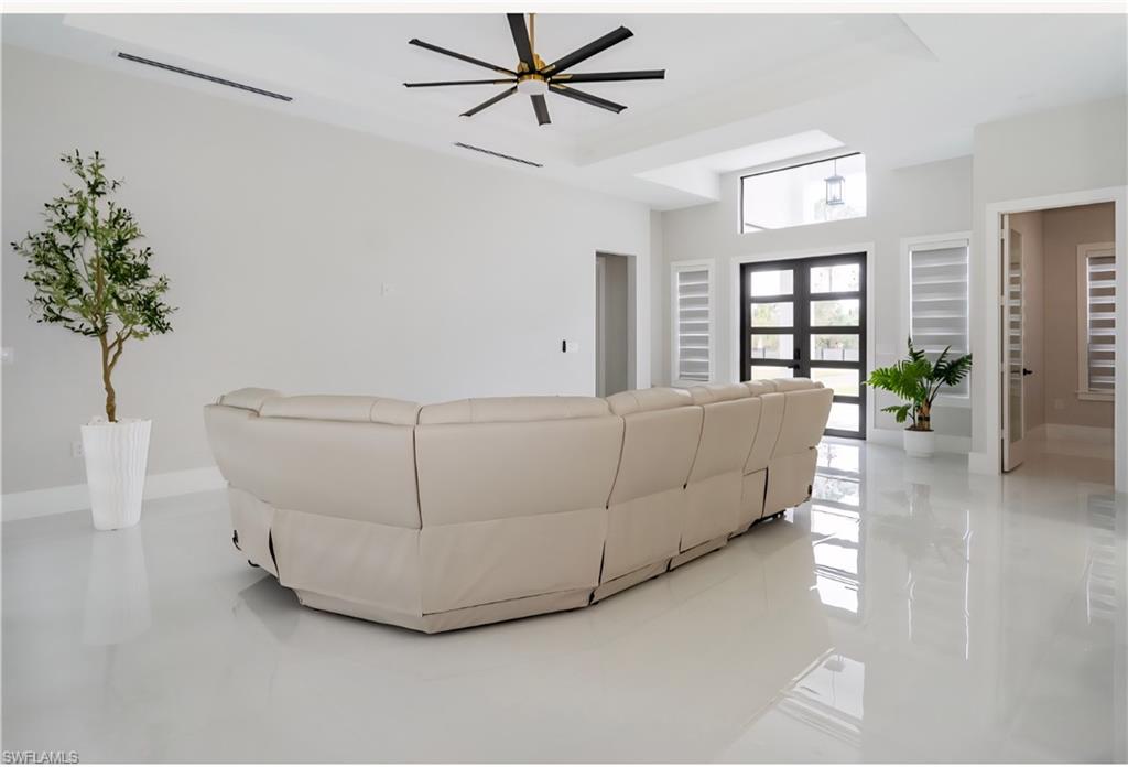 2313 6th Avenue Southeast Naples, FL 34117 - Photo 22 of 36 a living room with furniture and a potted plant