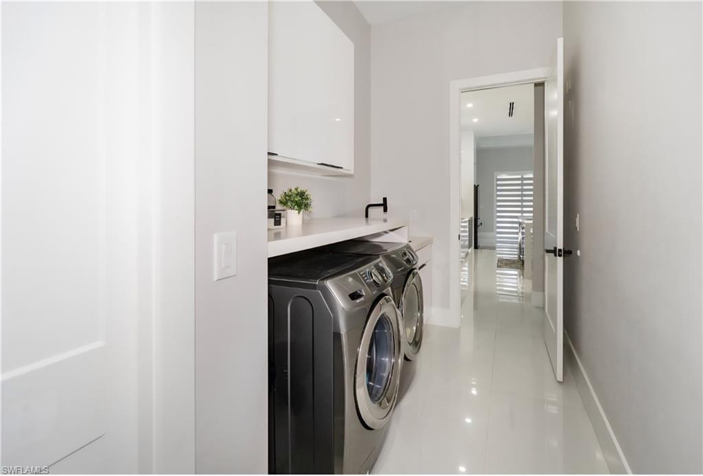 2313 6th Avenue Southeast Naples, FL 34117 - Photo 24 of 36 a utility room with dryer and washer
