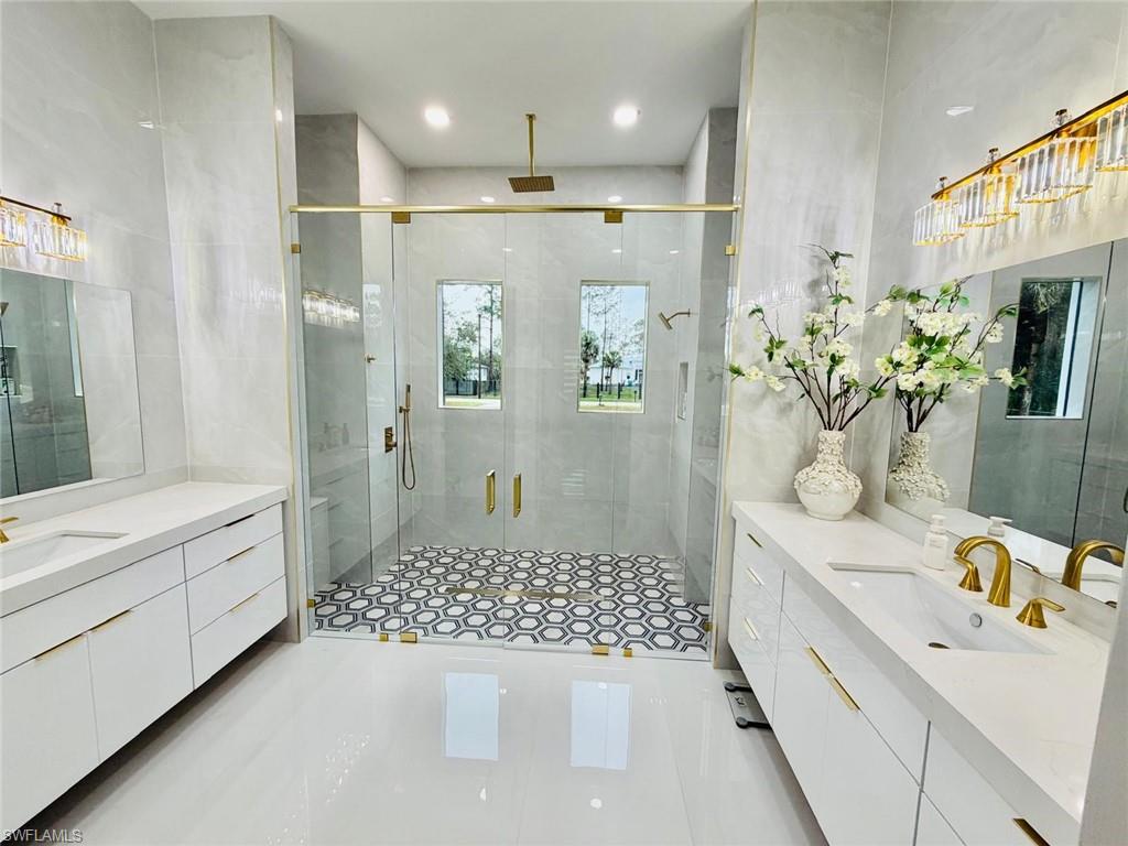 2313 6th Avenue Southeast Naples, FL 34117 - Photo 34 of 36 a bathroom with a sink a vanity and a shower