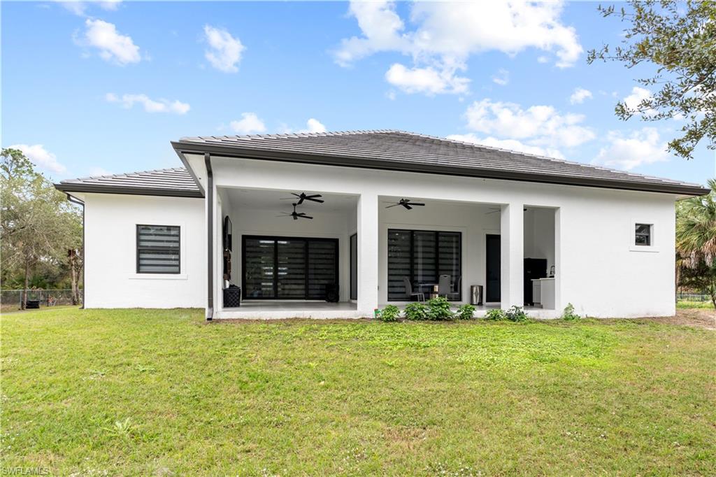 2313 6th Avenue Southeast Naples, FL 34117 - Photo 4 of 36 a view of a house with backyard and garden