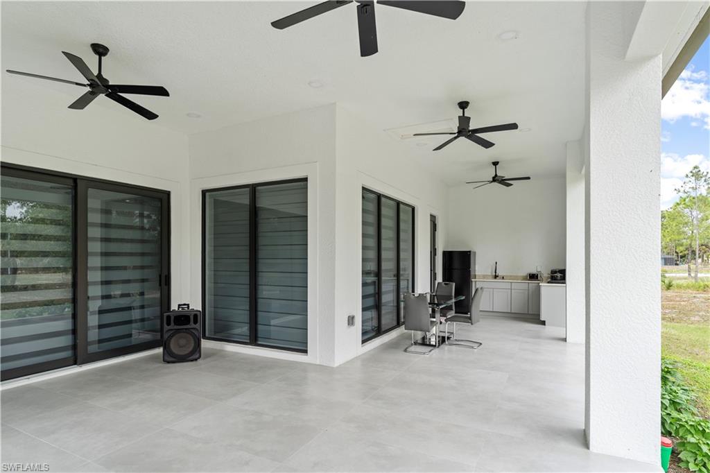 2313 6th Avenue Southeast Naples, FL 34117 - Photo 5 of 36 a view of a livingroom with furniture and windows