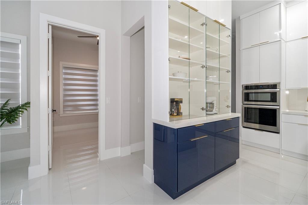 2313 6th Avenue Southeast Naples, FL 34117 - Photo 8 of 36 a view of kitchen with cabinets and wooden floor