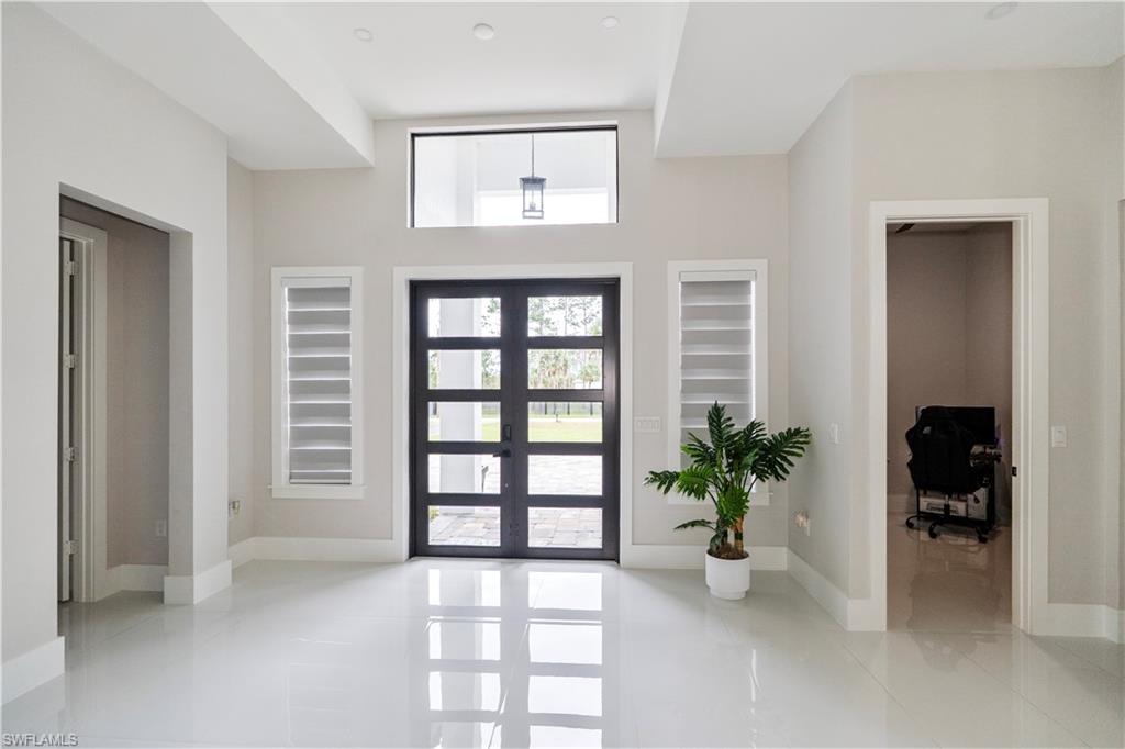 2313 6th Avenue Southeast Naples, FL 34117 - Photo 9 of 36 a view of an empty room with a window