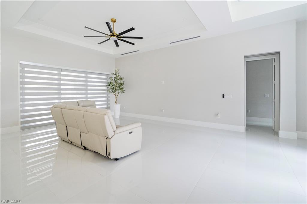 2313 6th Avenue Southeast Naples, FL 34117 - Photo 10 of 36 a living room with furniture and a window
