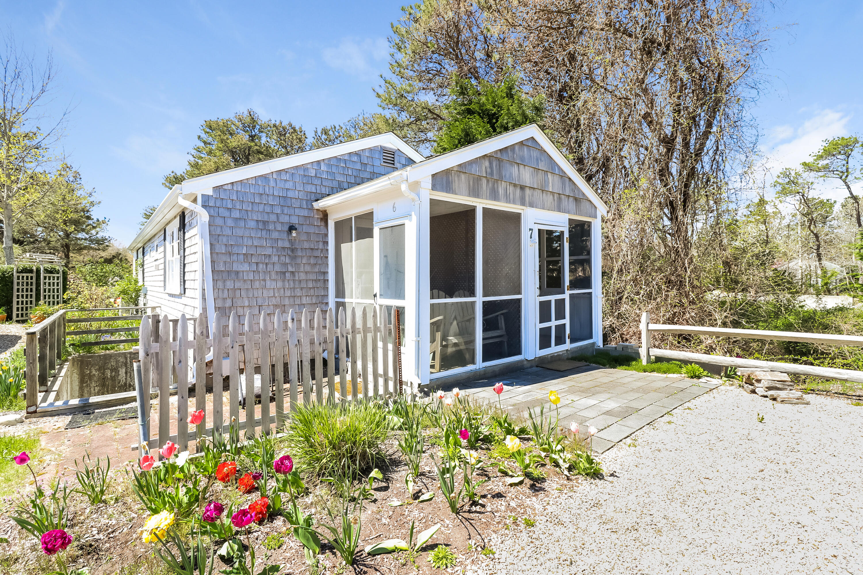 82 Shore Road, Unit 7 Truro, MA 02666 - Photo 12 of 13 a view of a house with a yard