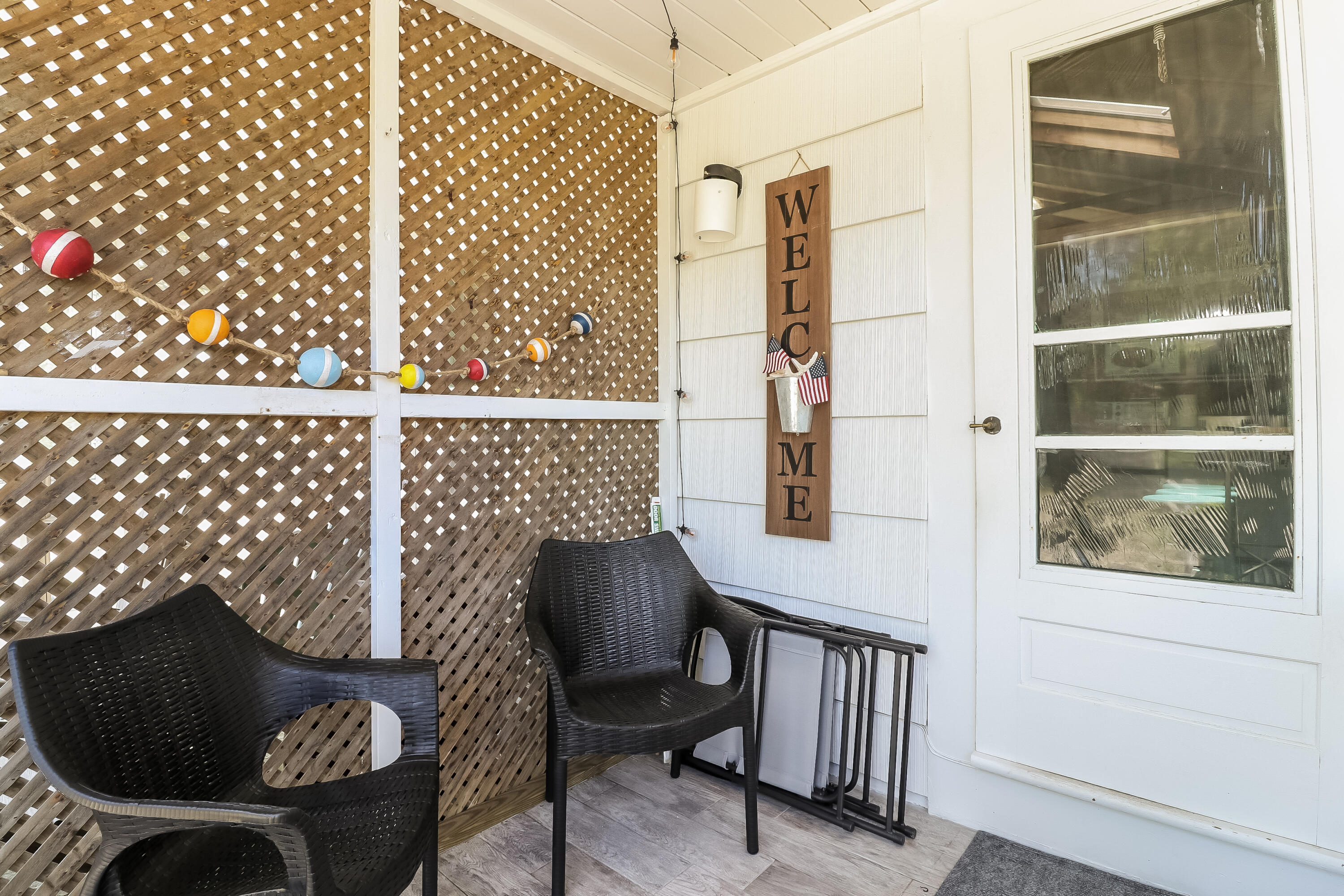 82 Shore Road, Unit 7 Truro, MA 02666 - Photo 8 of 13 a balcony view with a chair and a potted plant