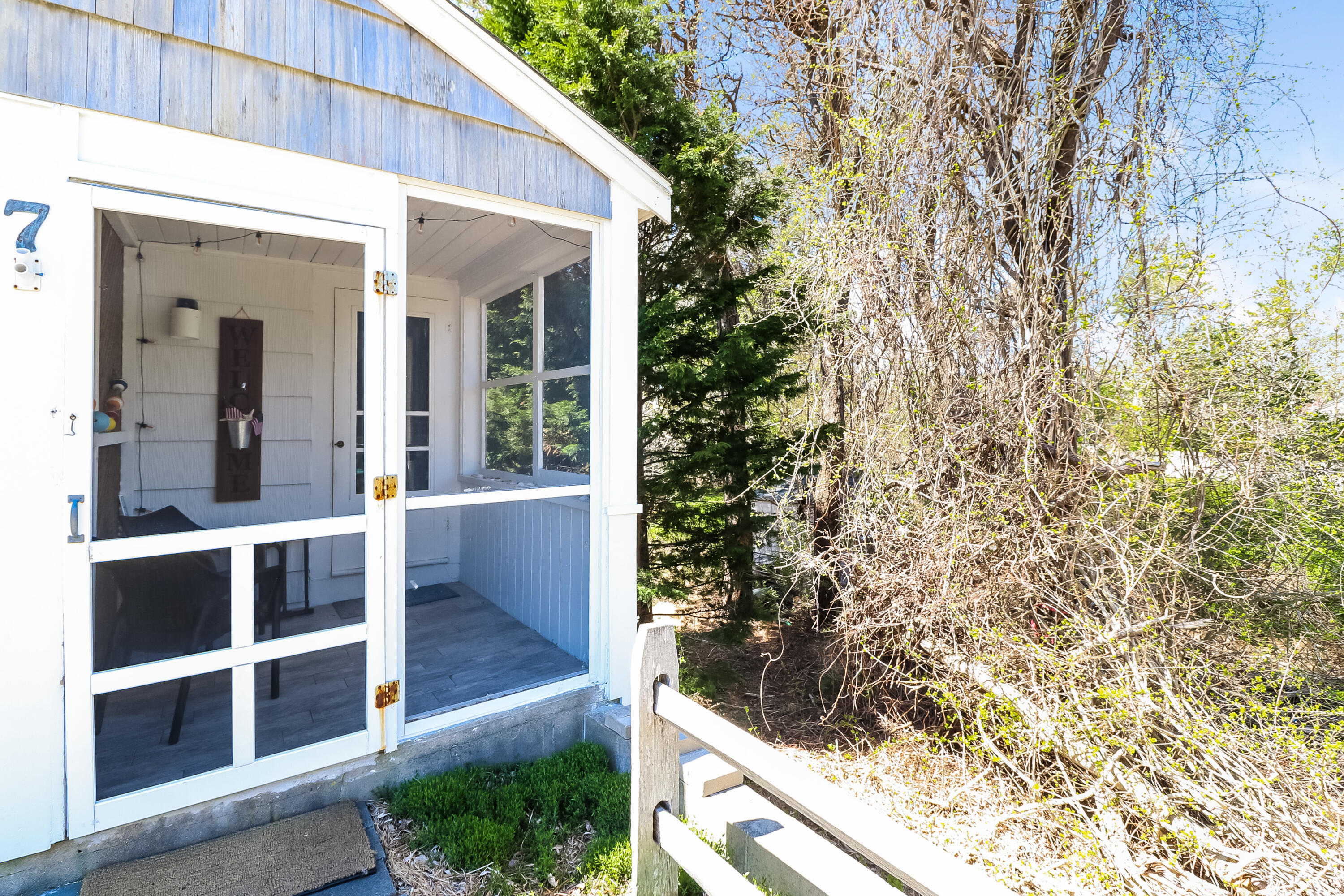 82 Shore Road, Unit 7 Truro, MA 02666 - Photo 9 of 13 a view of house with backyard