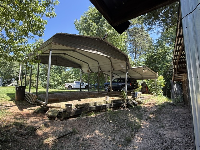 731 Glenn Ferry Road Fair Play, SC 29643 - Photo 22 of 23 A spacious carport offers ample covered parking and convenient storage space.