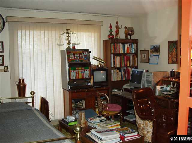 570 Cyma Circle Reno, NV 89503 - Photo 13 of 13 a view of a workspace with bookshelf and a window