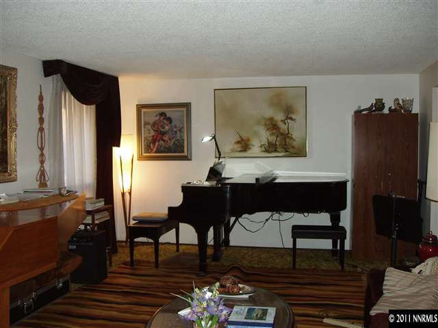570 Cyma Circle Reno, NV 89503 - Photo 5 of 13 a view of a livingroom with furniture and couch
