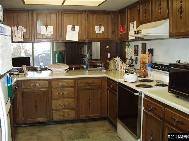 570 Cyma Circle Reno, NV 89503 - Photo 6 of 13 a kitchen with a sink stove and cabinets