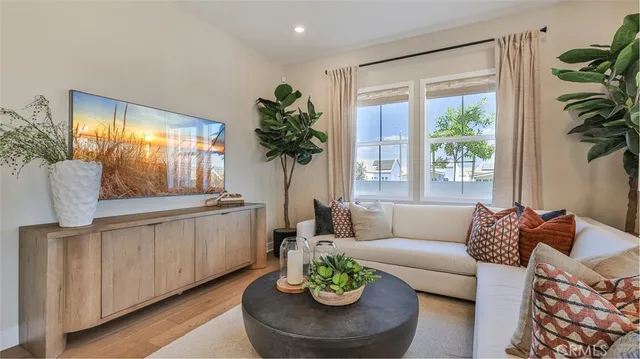 a living room with furniture and a large window
