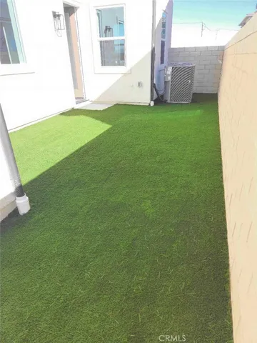 a view of a backyard with a garden and plants