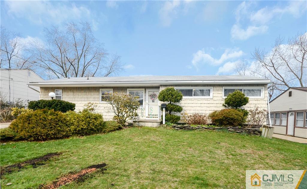 19 Rutgers Road Old Bridge, NJ 08859 - Photo 2 of 25 a front view of a house with garden