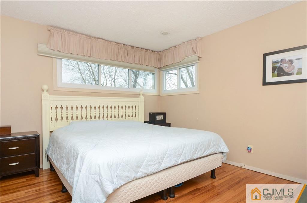 19 Rutgers Road Old Bridge, NJ 08859 - Photo 11 of 25 a bedroom with a bed and a window