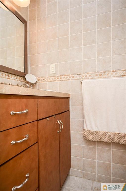 19 Rutgers Road Old Bridge, NJ 08859 - Photo 16 of 25 a bathroom with a sink and a mirror