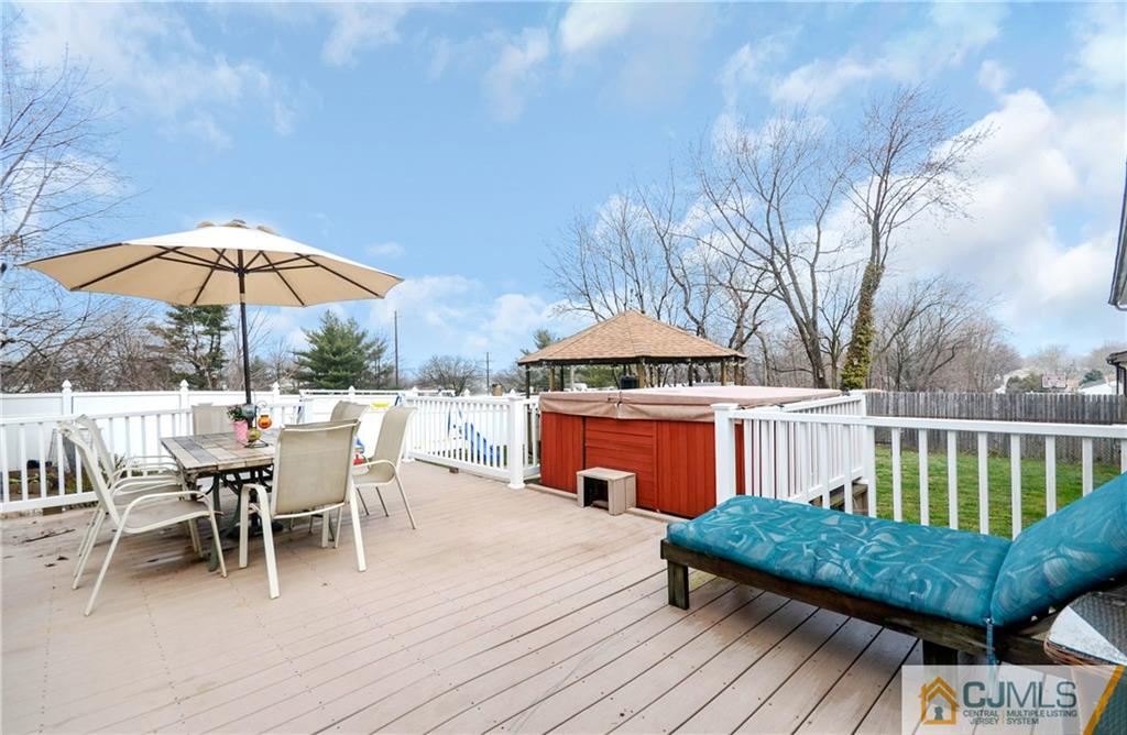 19 Rutgers Road Old Bridge, NJ 08859 - Photo 20 of 25 a view of a chairs and table on the deck