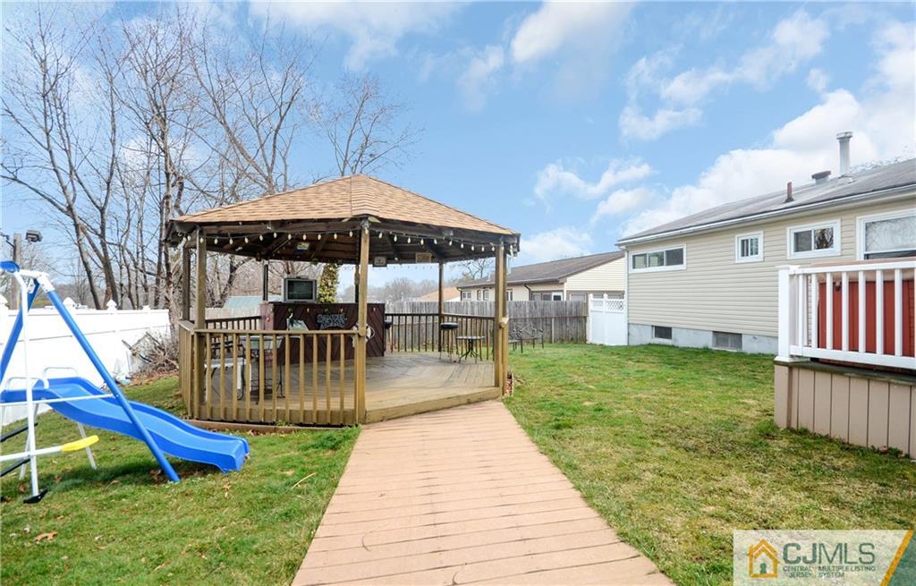 19 Rutgers Road Old Bridge, NJ 08859 - Photo 21 of 25 a view of a house with backyard and sitting area
