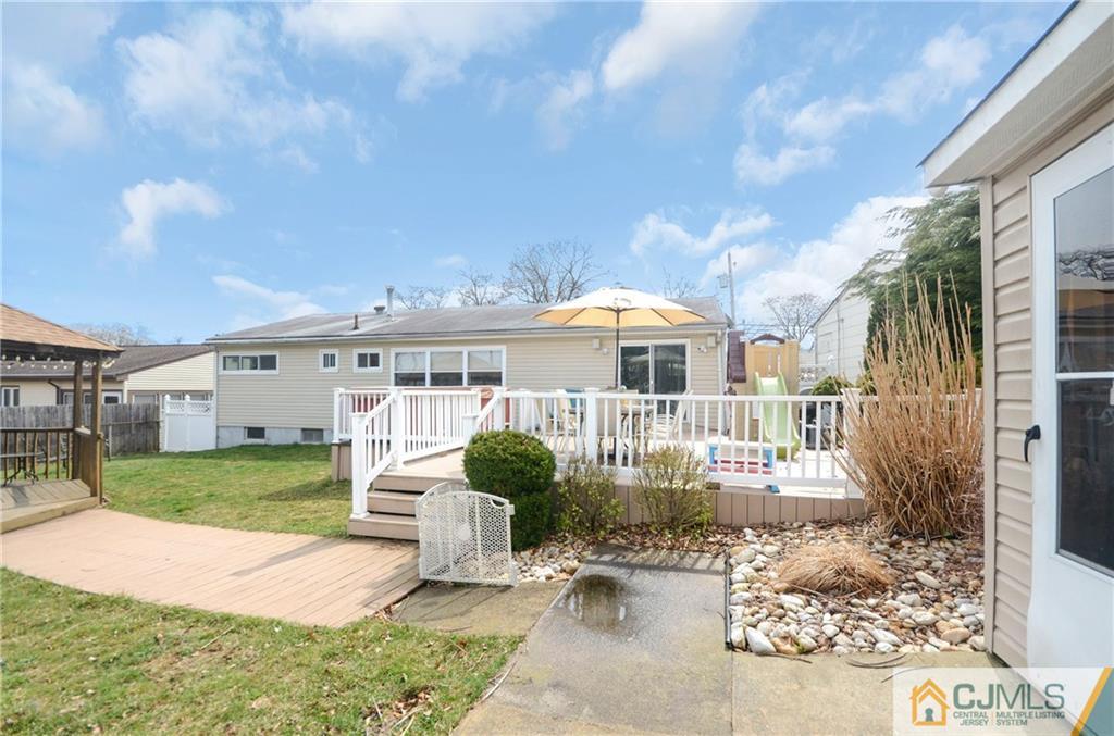 19 Rutgers Road Old Bridge, NJ 08859 - Photo 23 of 25 a front view of a house with garden
