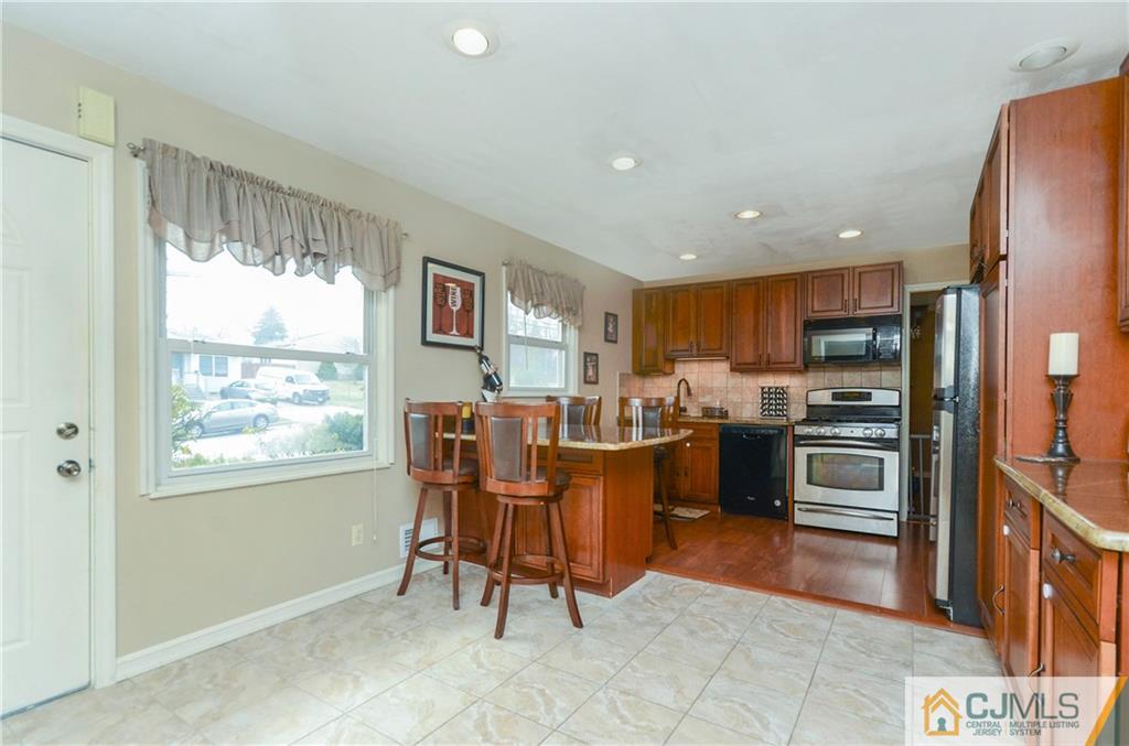 19 Rutgers Road Old Bridge, NJ 08859 - Photo 5 of 25 a view of a dining room with furniture window and outside view