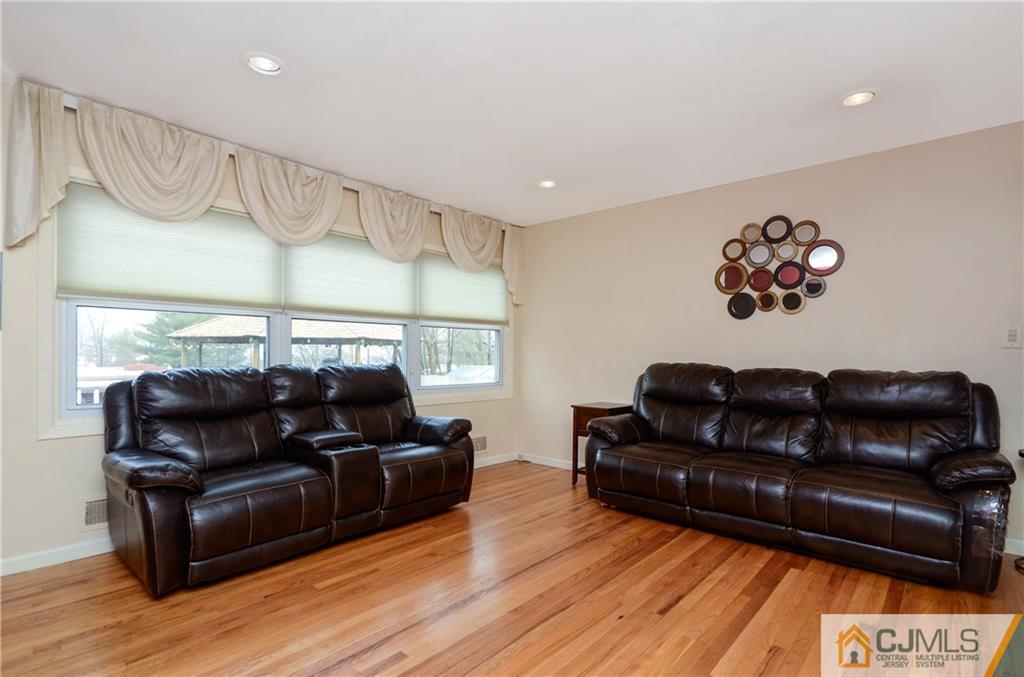 19 Rutgers Road Old Bridge, NJ 08859 - Photo 9 of 25 a living room with furniture and wooden floor