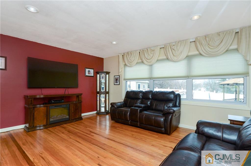 19 Rutgers Road Old Bridge, NJ 08859 - Photo 10 of 25 a living room with furniture and a flat screen tv