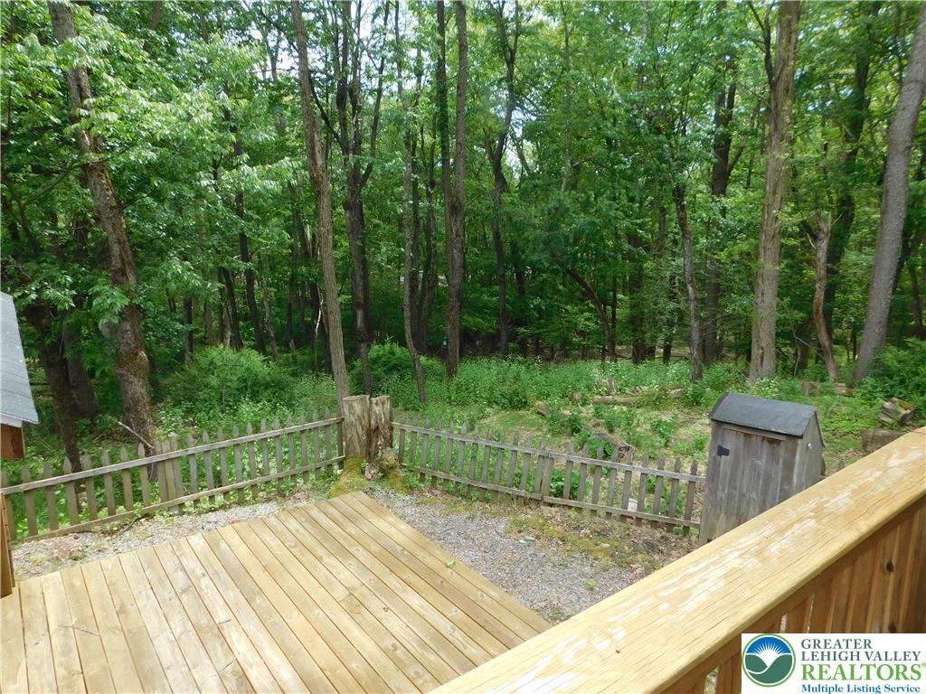 41 Reeder Street Mount Pocono, PA 18344 - Photo 8 of 41 A tranquil wooded view unfolds from this inviting wooden deck.