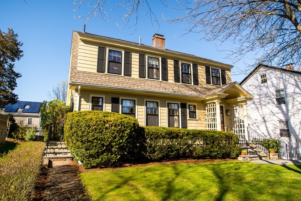 23 Virginia Road Waltham, MA 02453 - Photo 1 of 18 a front view of a house with a yard