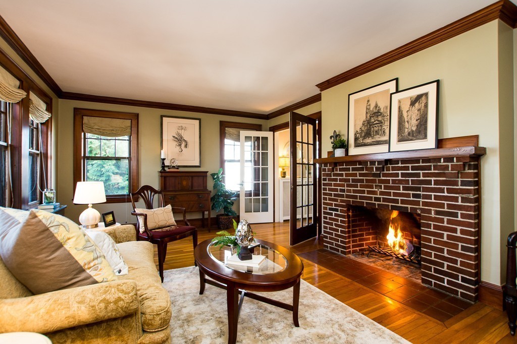 23 Virginia Road Waltham, MA 02453 - Photo 7 of 18 a living room with furniture and a fireplace