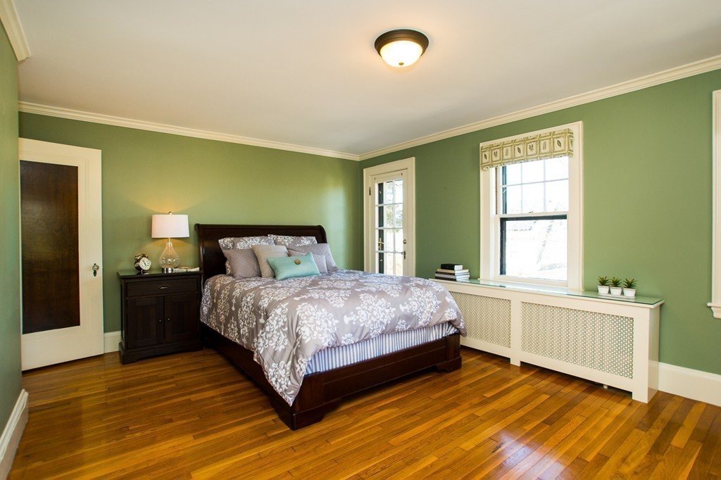 23 Virginia Road Waltham, MA 02453 - Photo 9 of 18 a spacious bedroom with a bed and a window