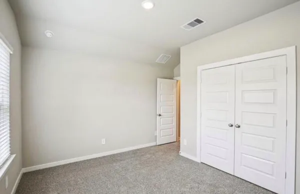 an empty room with closet