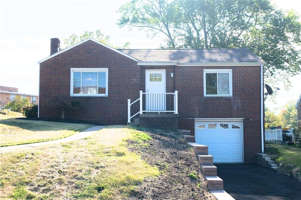 a front view of house with yard