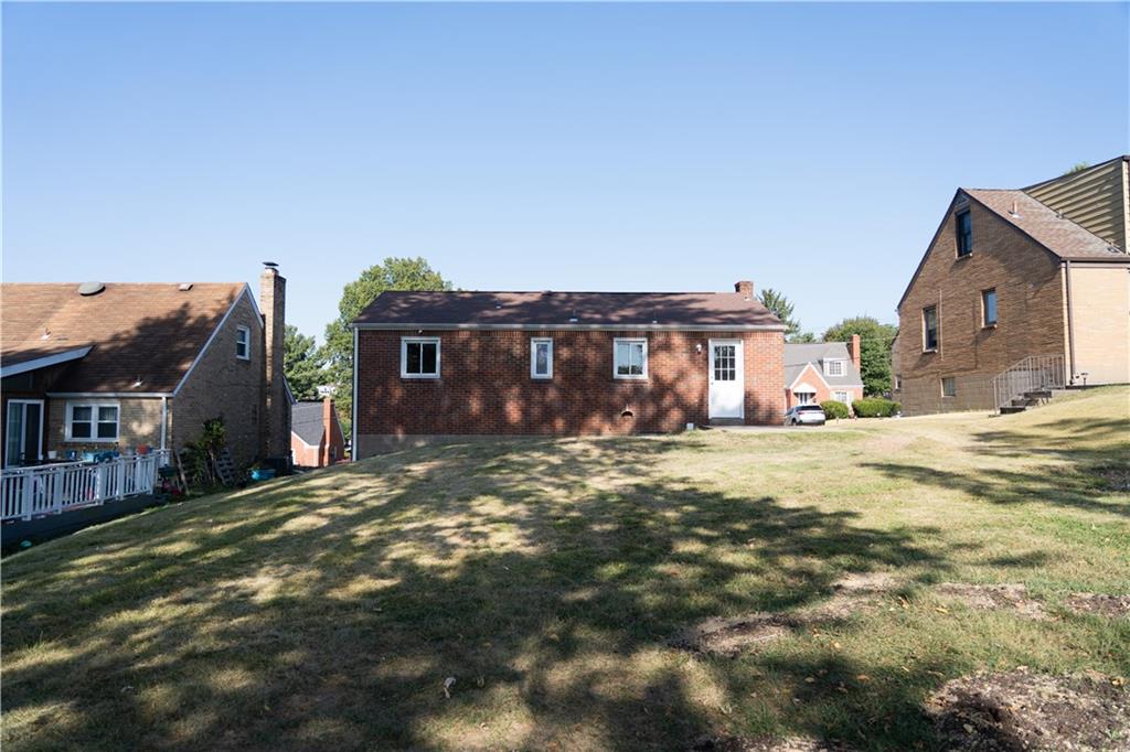 746 Lechner Lane Pittsburgh, PA 15227 - Photo 21 of 25 a front view of a house with a yard