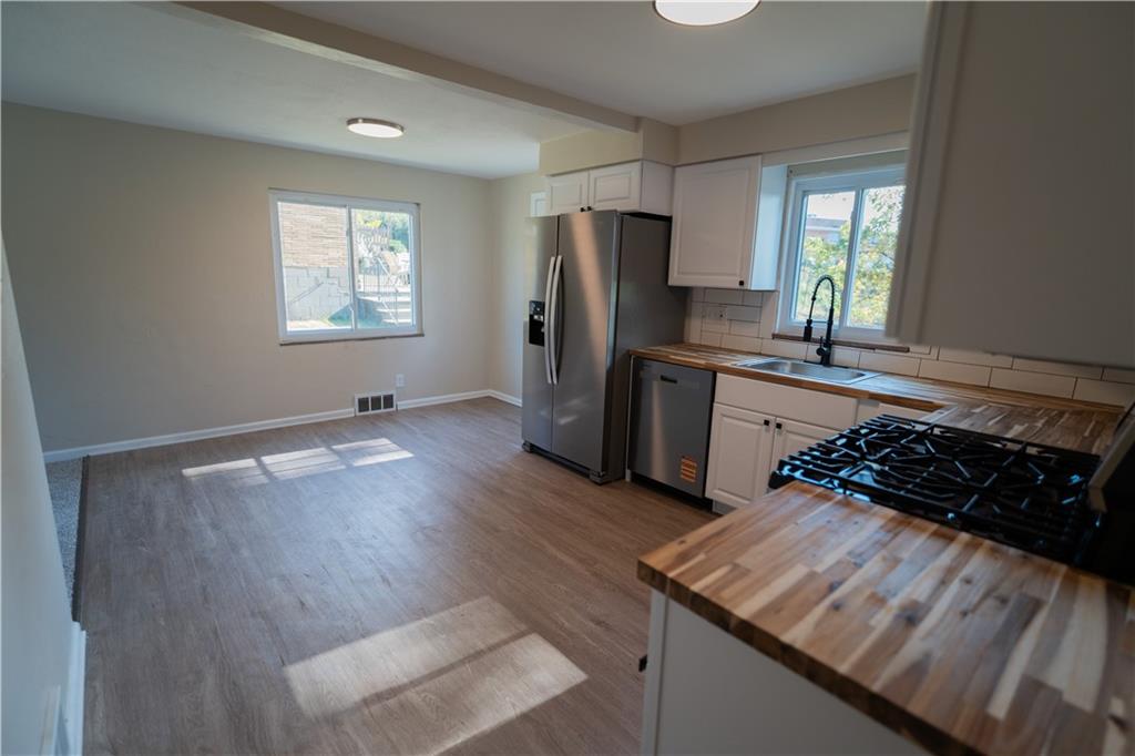 746 Lechner Lane Pittsburgh, PA 15227 - Photo 3 of 25 a kitchen with sink refrigerator and window
