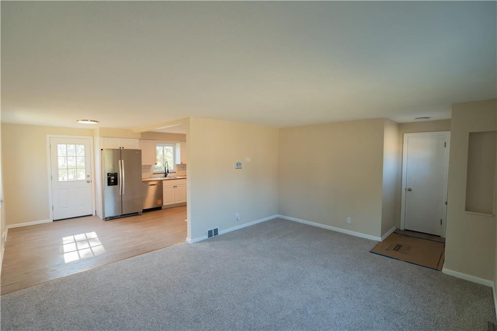 746 Lechner Lane Pittsburgh, PA 15227 - Photo 5 of 25 an empty room with windows and entrance to other room