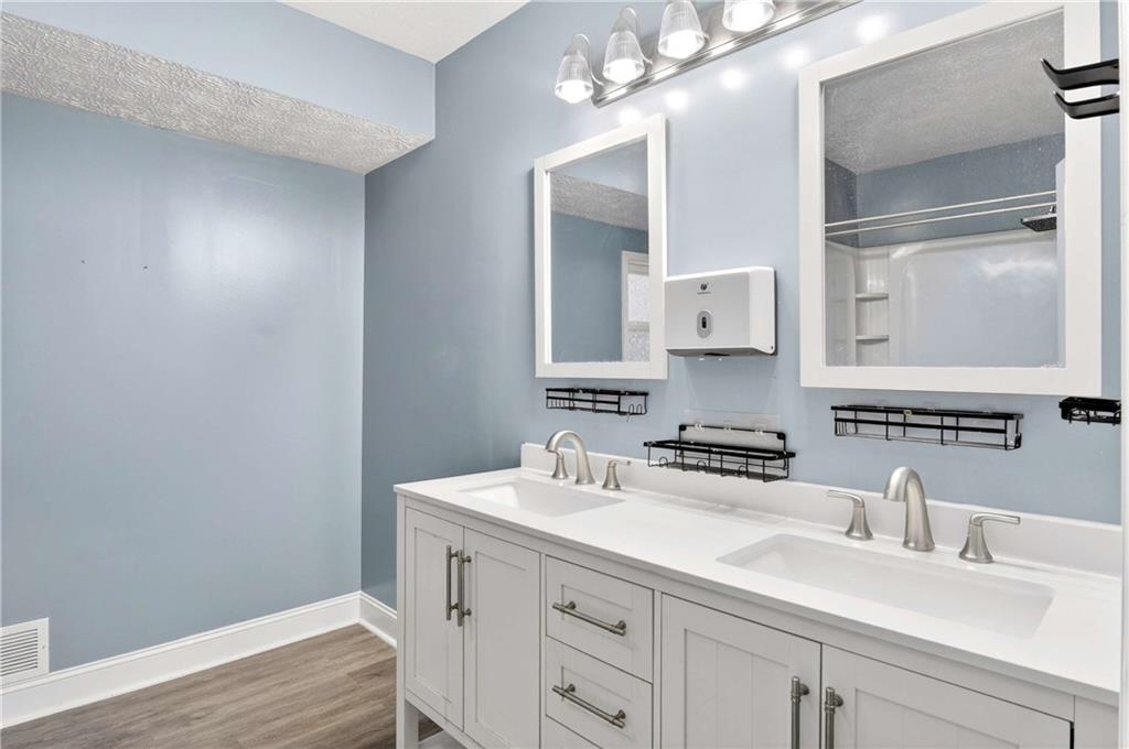 808 Emerald Chase Powder Springs, GA 30127 - Photo 13 of 32 a bathroom with a sink a vanity and a mirror